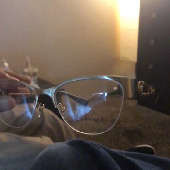 There Versace frames black and gold with Versace imprinted on lenses - Picture 2 of 3